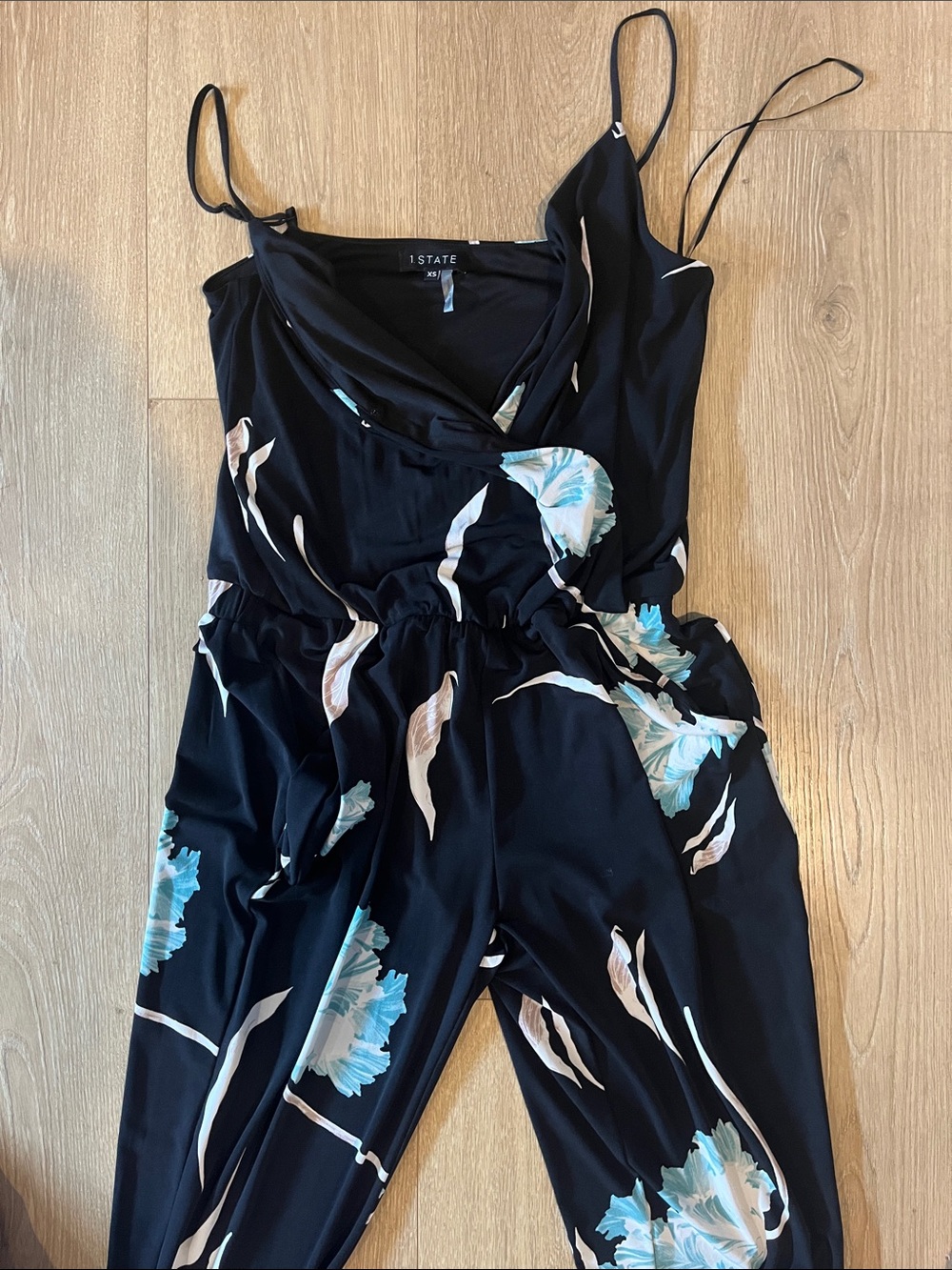 1. State Black Floral Jumpsuit with Blue and Cream Blooms